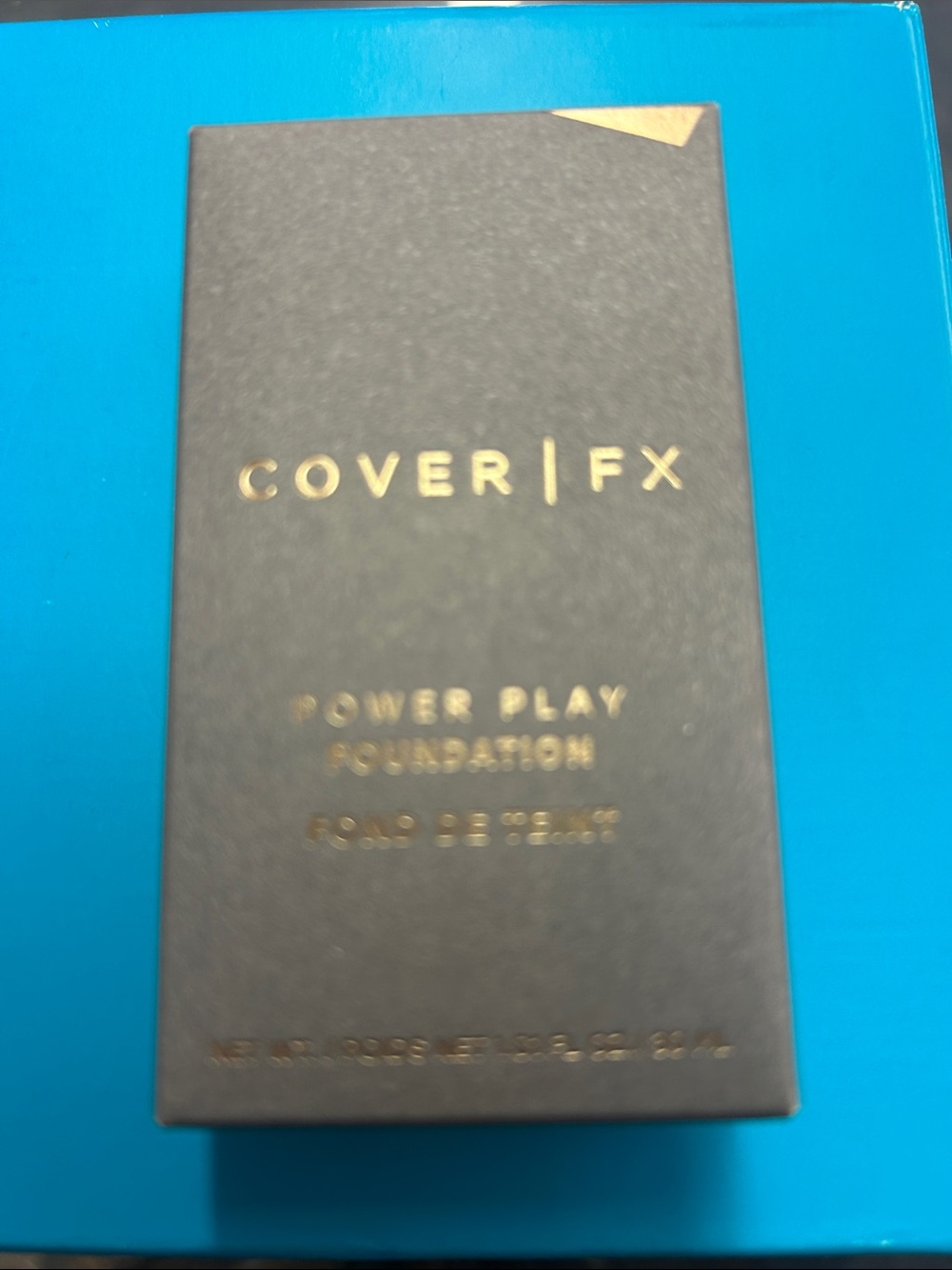 COVER FX Power Play Foundation — Matte Black with Gold Accents Shade M4